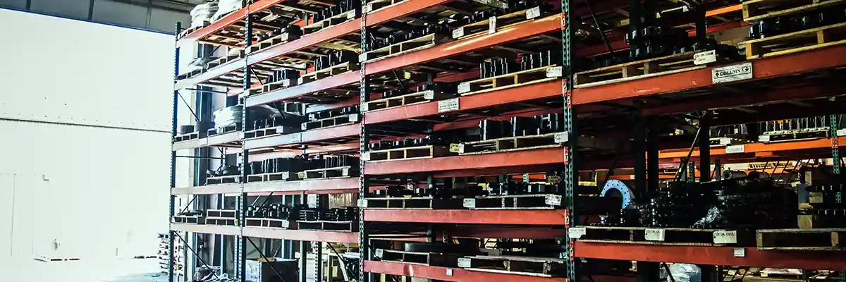 Plant parts stocked on shelves in the Hotmix Parts Warehouse