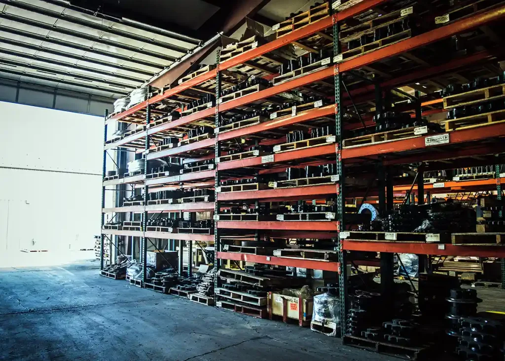 Plant parts stocked on shelves in the Hotmix Parts Warehouse